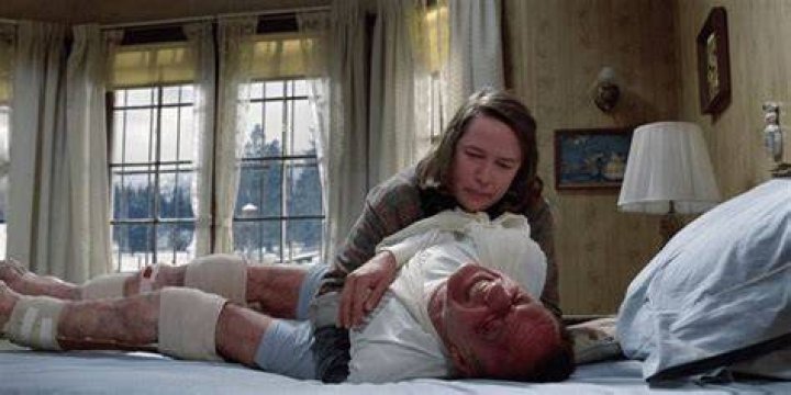 Annie tortures Paul on bed in Misery