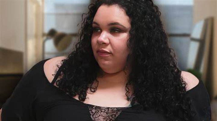 ashley barnard 600 lb life looking to side in dark outfit long hair