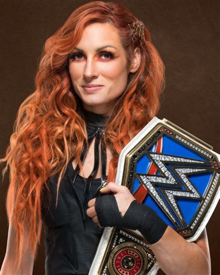 Becky Lynch wrestling in Japan with luchador Brazo de Platino
