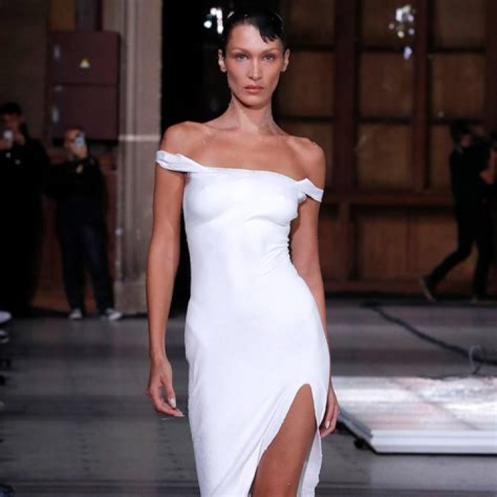 Bella Hadid Gets Dress Sprayed on Her Nude Body At Paris Fashion Week
