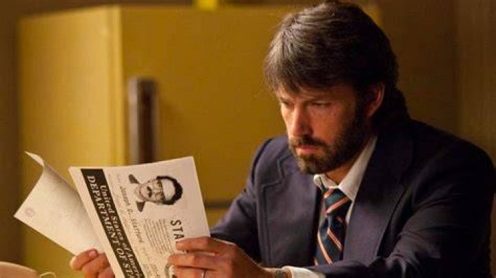 Ben Affleck reading documents in Argo.