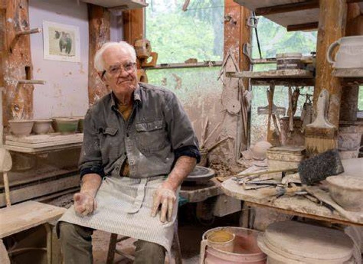 Bill Murray sits at his desk in The French Dispatch