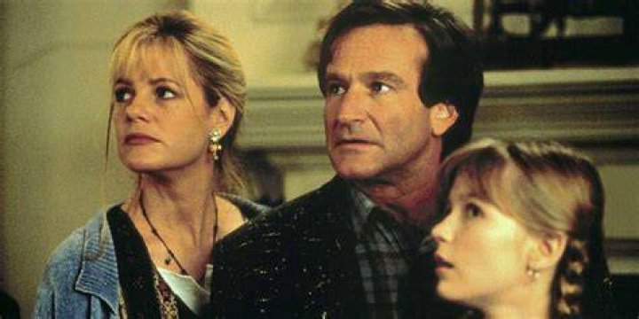 Bonnie Hunt, Robin Williams, and Kirsten Dunst look on scared in Jumanji