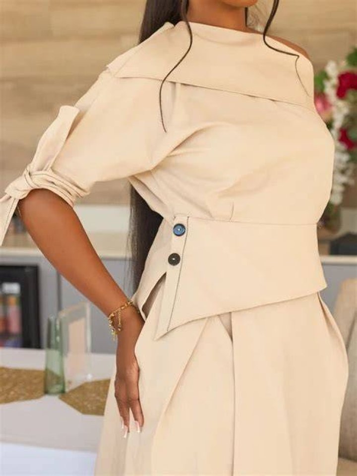 Buttoned one-shoulder gown with a V-neckline and faux pockets