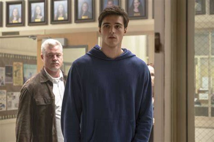 Cal Jacobs looking at family photo in Euphoria.