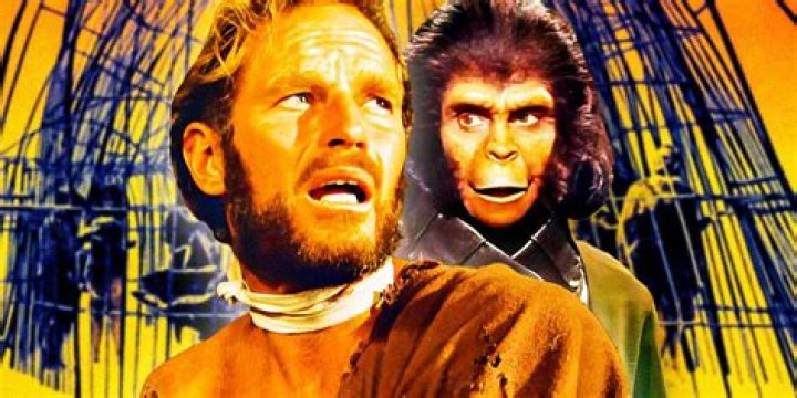 Charlton Heston as George Taylor is surrounded by apes in Planet of the Apes.