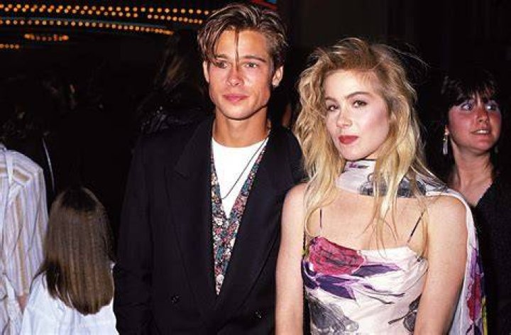 Christina Applegate and Brad Pitt smiling