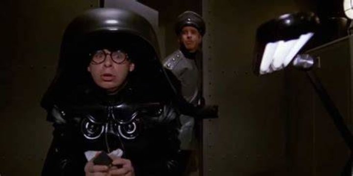 Colonel Sandurz walking in on Dark Helmet playing with dolls in Spaceballs