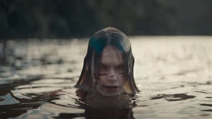 Deadite Jessica in the lake in Evil Dead Rise's opening scene