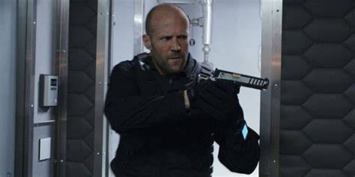 Deckard Shaw pointing a gun in F8