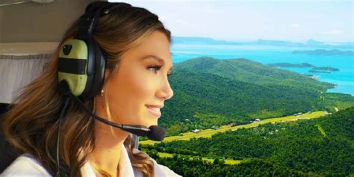 Delta Goodrem as Dana in Love Is in the Air with a background of Whitsunday Airport