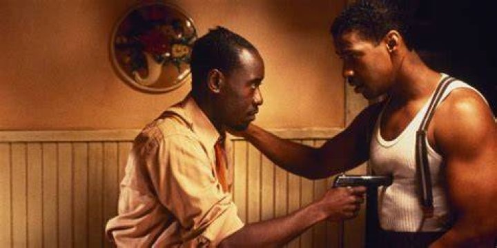Don Cheadle pointing a gun at Denzel Washington's chest in Devil in a Blue Dress