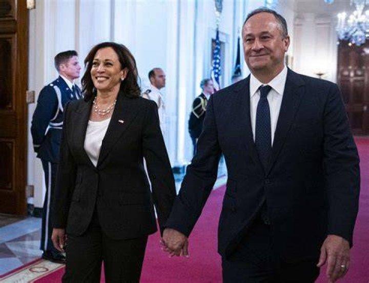 Doug Emhoff (from left), Vice President Elect Kamala Harris, Cole Emhoff, Ella Emhoff, and Vice President Mike Pence stand as Lady Gaga sings. Photo / AP