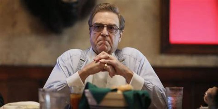 Dr Eli Gemstone sitting at his dining table.