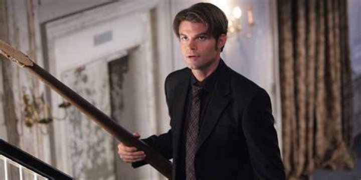 Elijah in The Vampire Diaries looks at someone off camera.