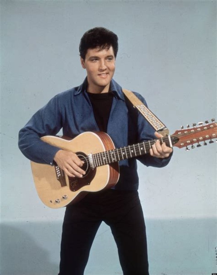 Elvis Presley poses with guitar in a promotional still for the movie "Jailhouse Rock" circa 1957. Photo / Supplied
