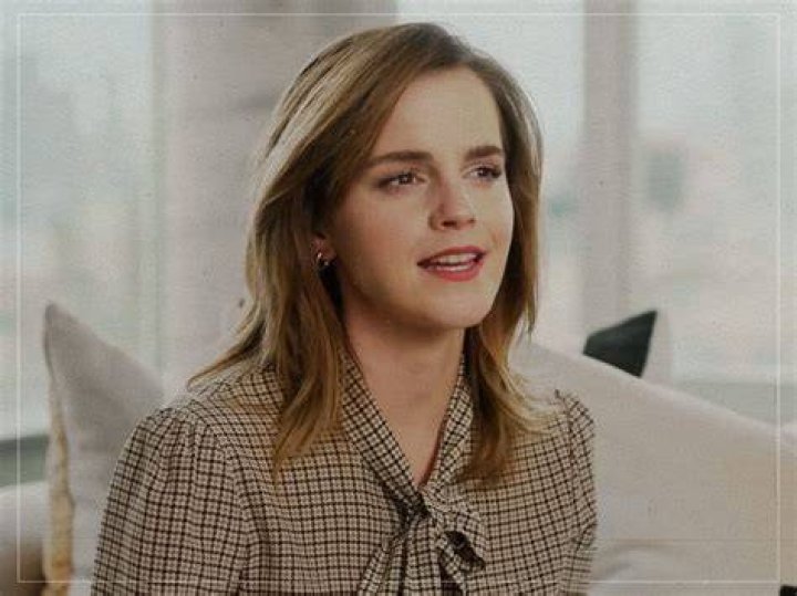 Emma Watson glances to her right in the Gryffindor Common Room.