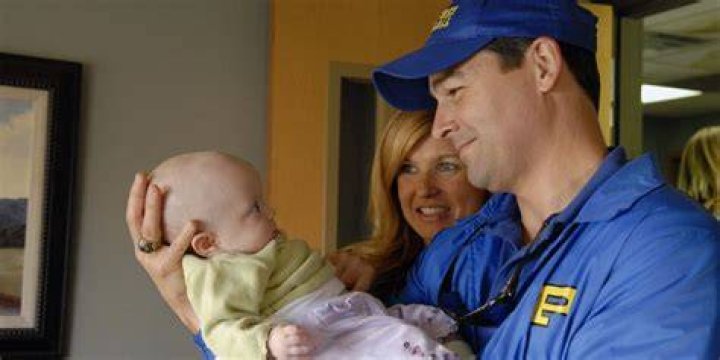 Eric Taylor with wife Tami and their newborn daughter.