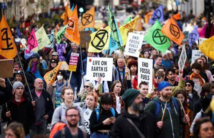 Extinction Rebellion activists at London Fashion Week in September, calling for the British Fashion Council to cancel London Fashion Week until it can be sustainable. Photo / Getty Images