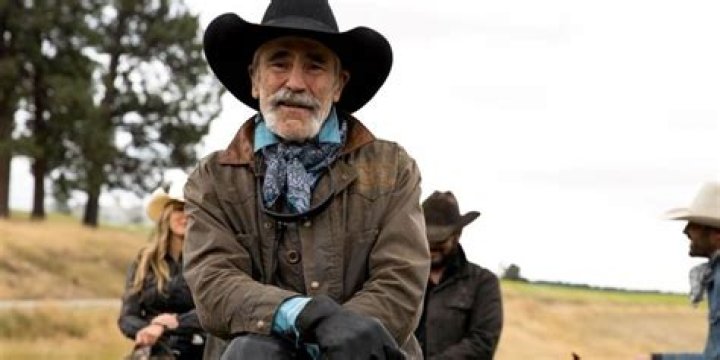 Forrie J Smith as Lloyd Pierce sitting on a horse in Yellowstone.