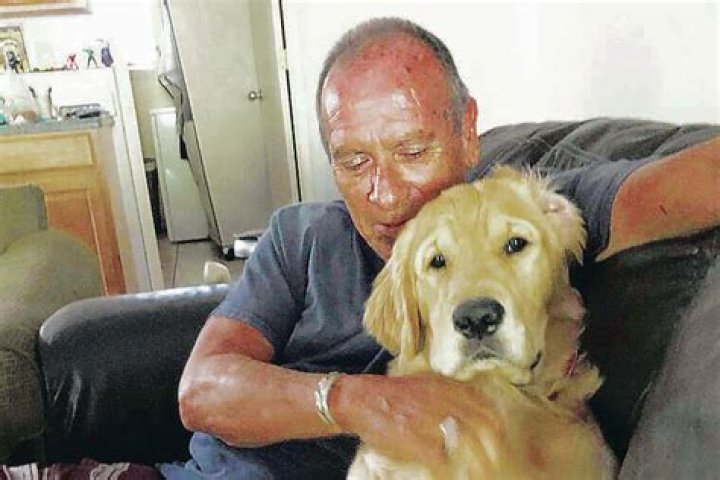 Franklin Trejos with his golden retriever Sam. Photo / AP