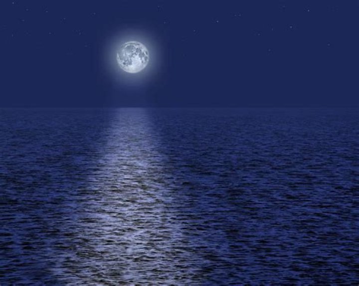 Full moon over the ocean.