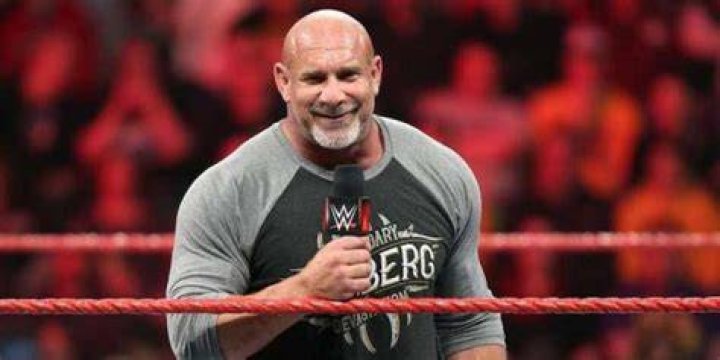 goldberg holding a mic