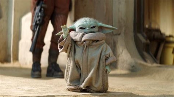 Grogu, aka Baby Yoda from The Mandalorian, with Mando on the left, and with Luke Skywalker on the right, separated by a shot of Baby Yoda standing. 