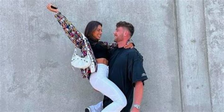Harry Jowsey and Georgia Hassarato from Too Hot To Handle looking at each other smiling