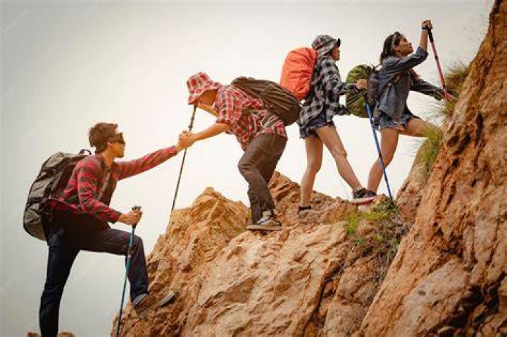 Hikers climb a hill on the Motatapu track. Photo / Scott K MacLeod