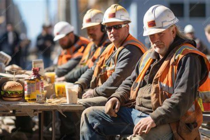 Intrepid steel workers eat lunch atop the 70 story RCA building in Rockefeller Centre in New York in 1932. Photo / Getty Images