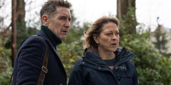 Jake Strathearn and Annika outside looking worried in Annika