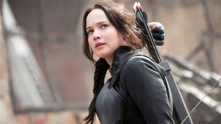 Jennifer Lawrence as Katniss Everdeen, Rachel Zegler as Lucy Gray, and Josh Hutcherson as Peeta Mellark in The Hunger Games movies