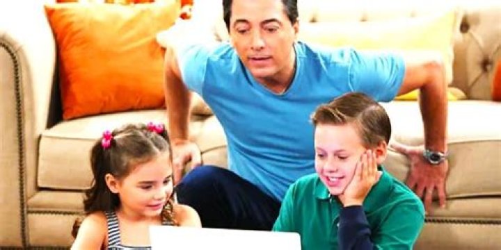 Joe Janie And David Hobbs looing at a laptop on See Dad Run