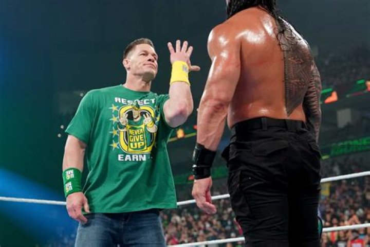 john cena on the screen bloodline in the ring