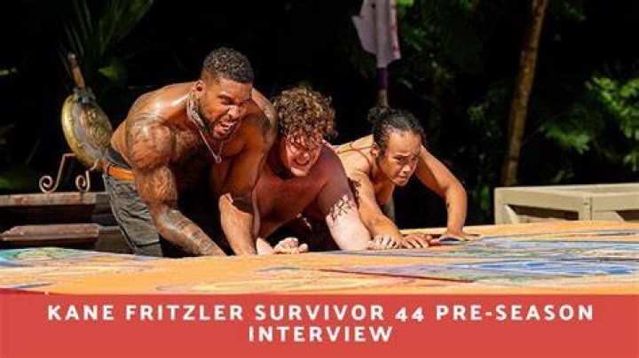 Kane Fritzler Survivor 44 gazing in distance in yellow shirt on beach