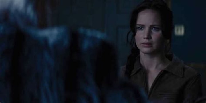 Katniss aiming her bow and arrow