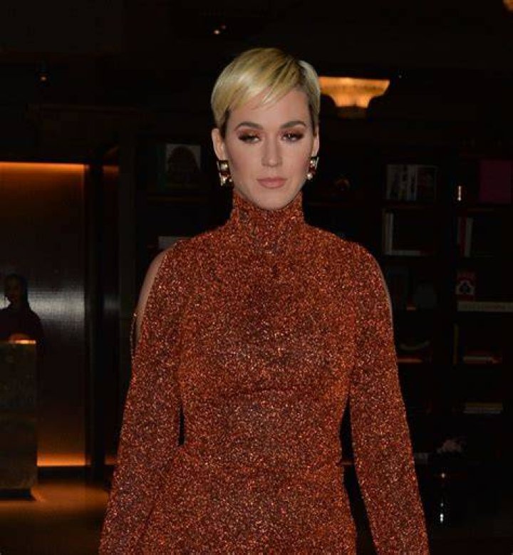 Katy Perry shows off her bare butt in a black leather thong and see