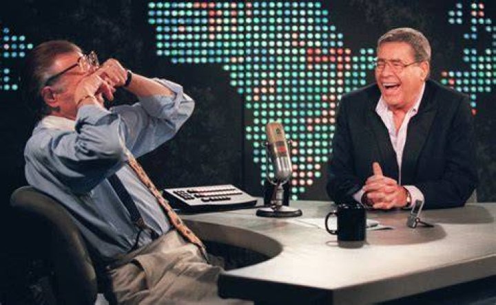 Larry King wipes his eyes after laughing at a joke by comedy legend Jerry Lewis in 1999. Photo / AP