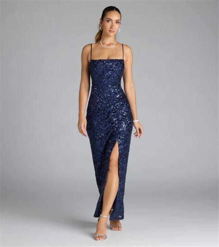 Long sequined gown with spaghetti straps and high fron side slit