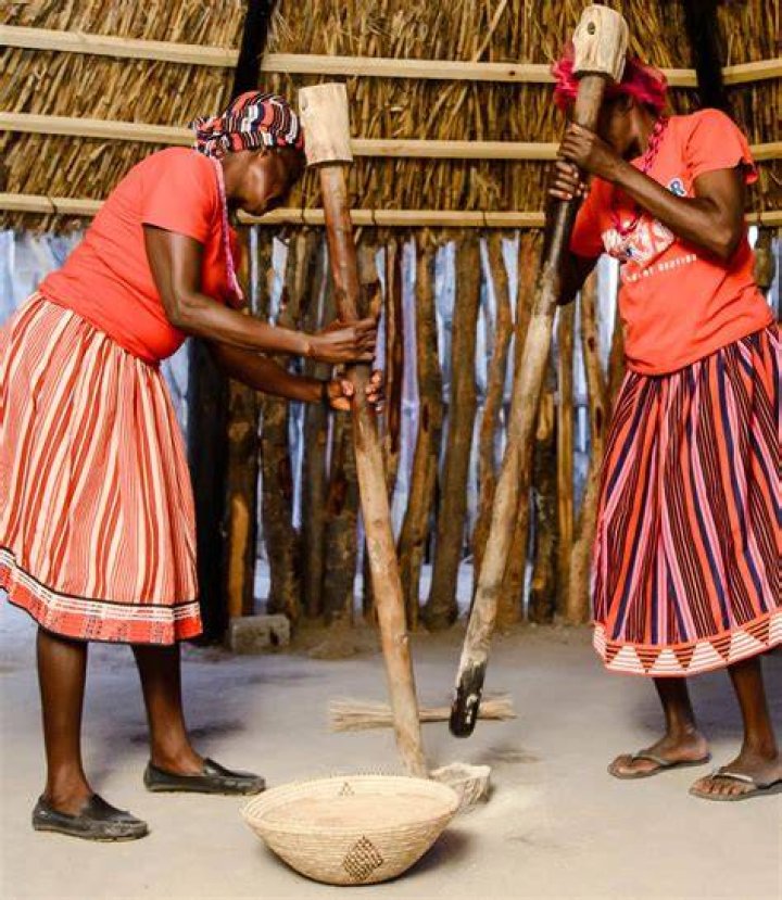 &lrm;Two Nyaheun women are pounding rice in a village in Attapu Province