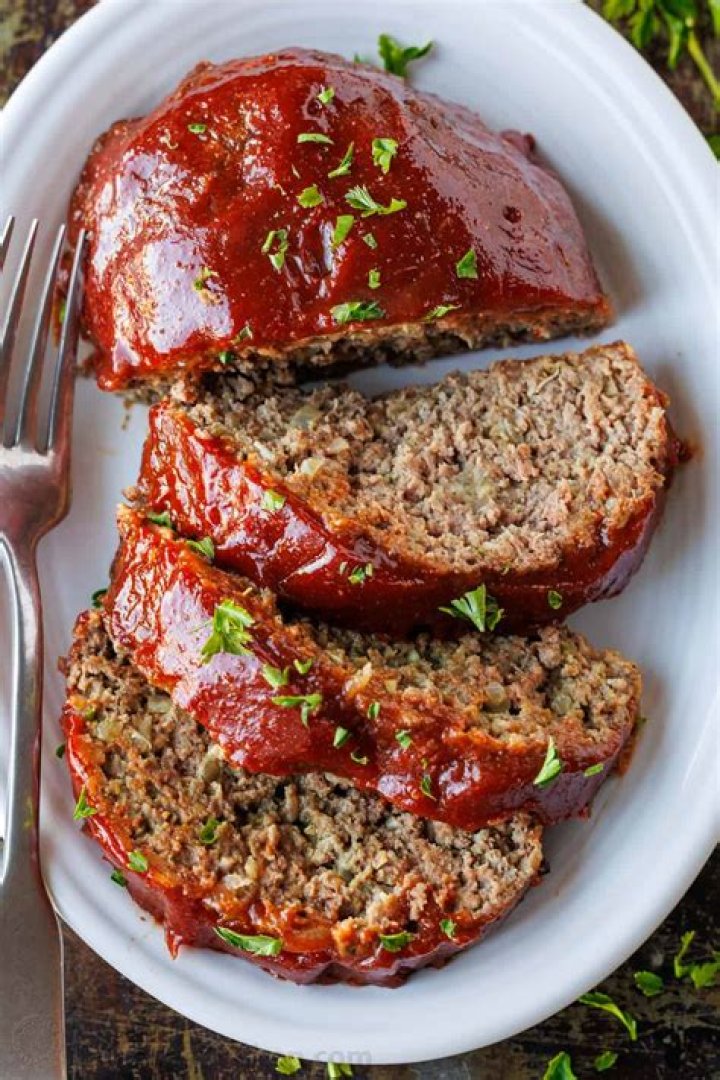 Meat Loaf leaning out a window in Focus