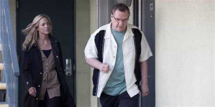 Meat Loaf walking by motel rooms in Beautiful Boy.