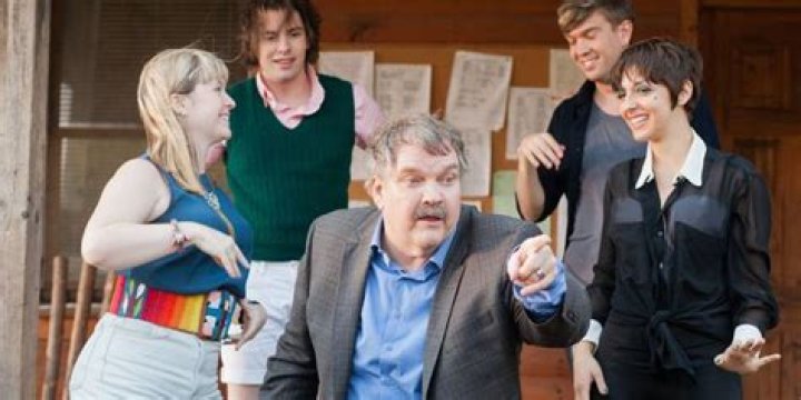 Meatloaf standing outside a cabin in Stage Fright.
