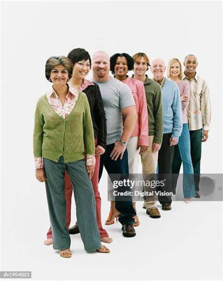 Men and women standing in colorful shirts
