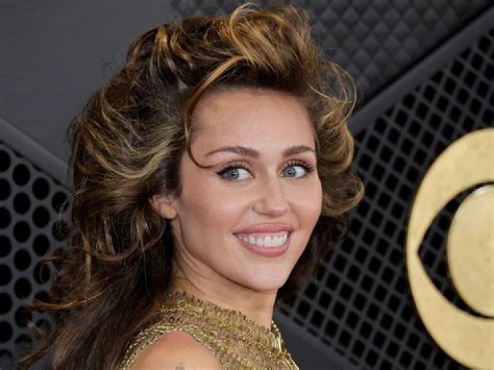 Miley Cyrus Tried to Make Her Hair Touch the Ceiling at the 2024 Grammy