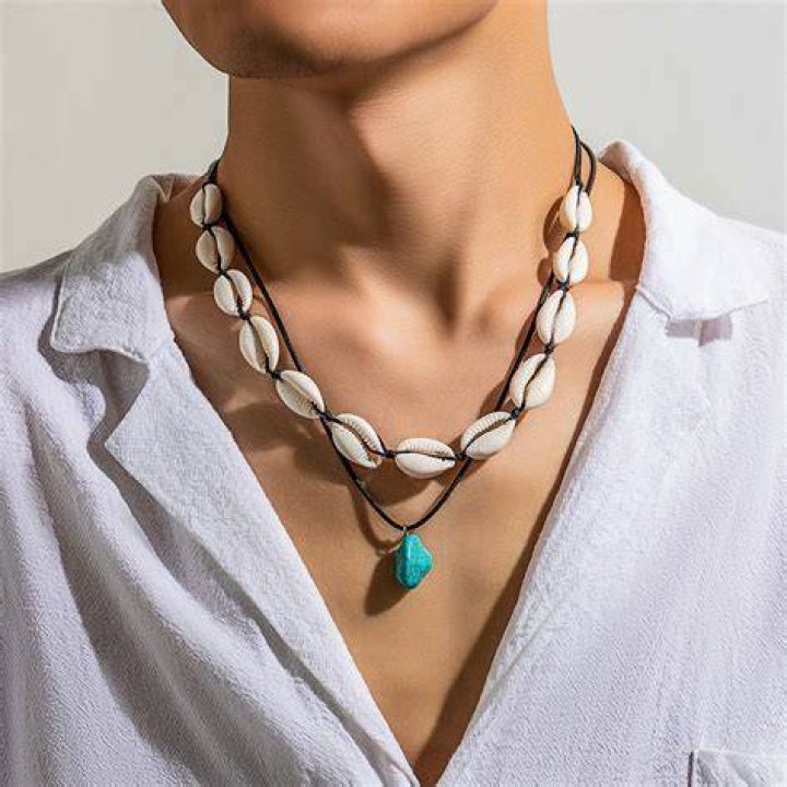 Model wearing shell necklace