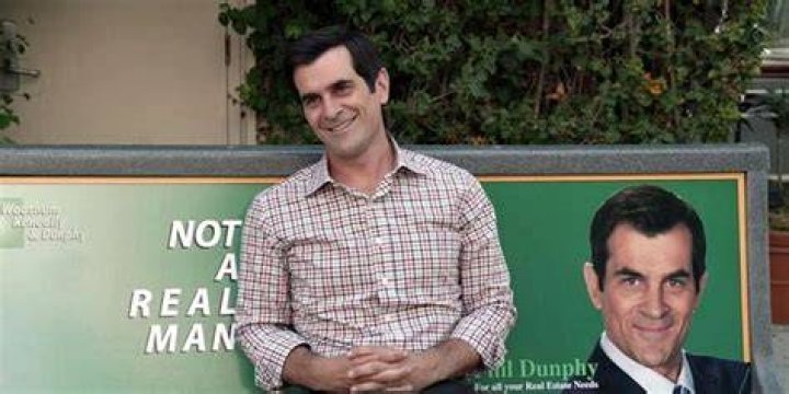 modern family phil dunphy real estate bench