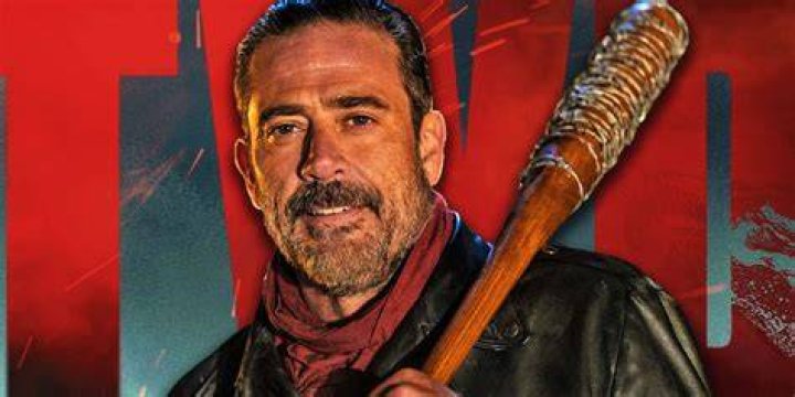 Negan from Walking Dead standing in front of comic book version of himself