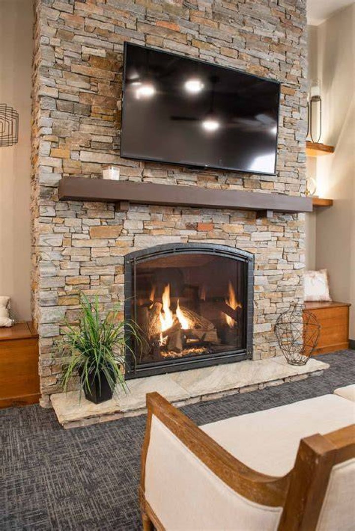 Olaf by a fireplace with Anna in Frozen